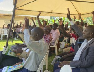 Delegates raise their hands at an EUDR workshop